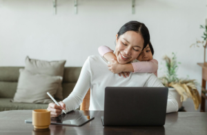 woman with laptop with child 