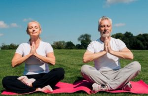 two people doing yoga