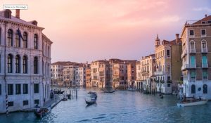 Gondolas on a canal between historic buildings in Venice